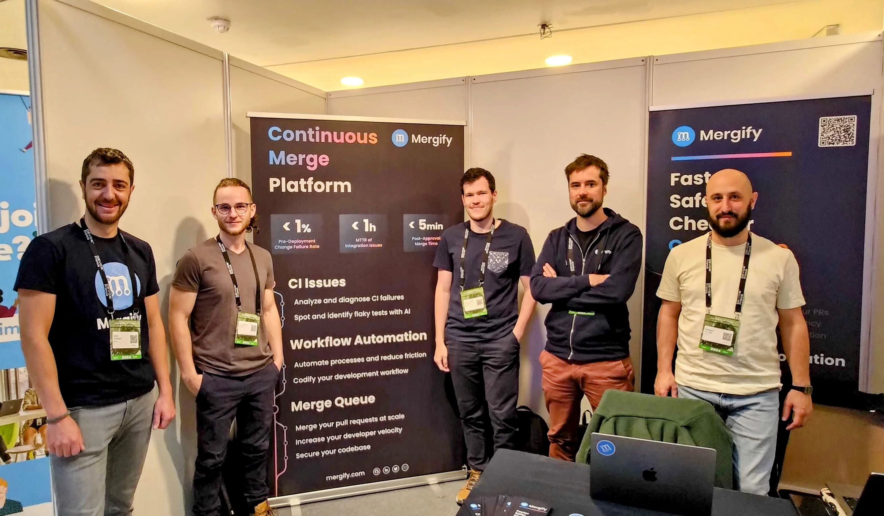 Mergify team at their booth at Devoxx France 2024